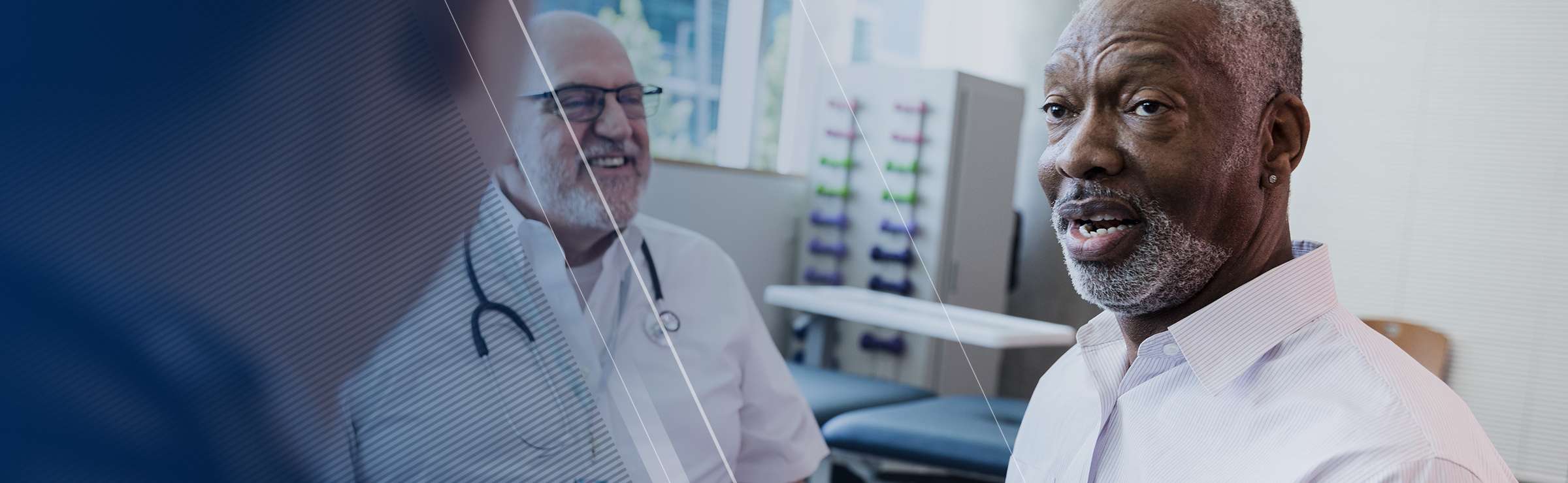 Man with beard talking to healthcare professional (HCP) wearing a stethoscope
