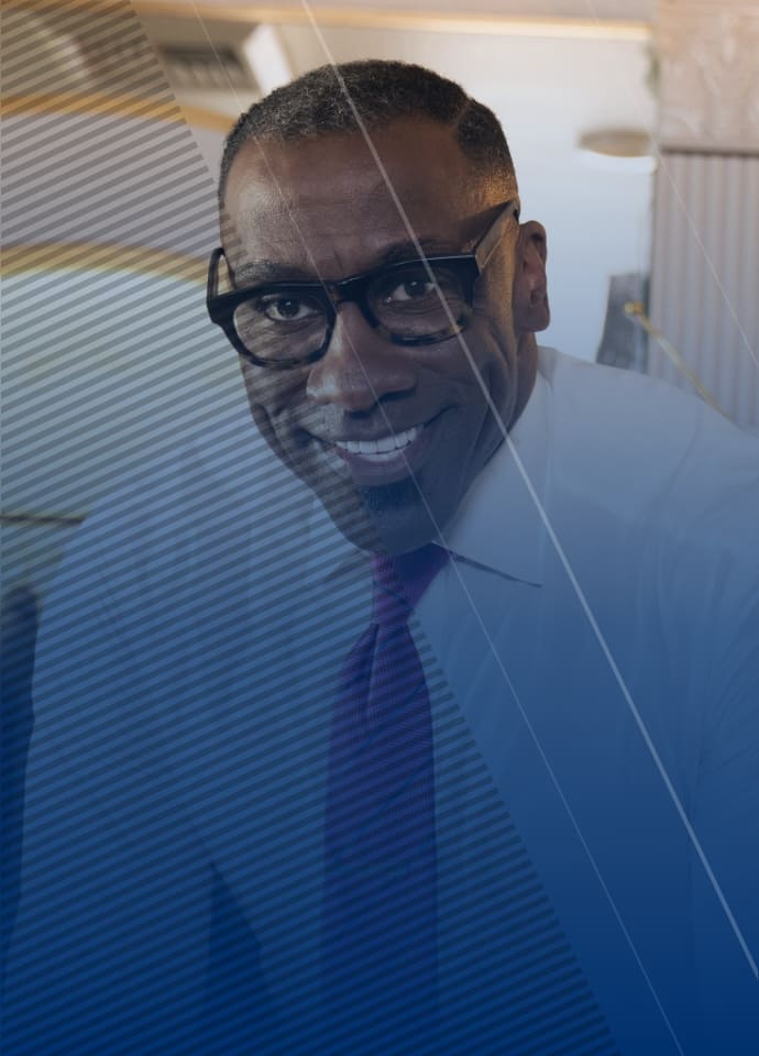 Image of Shannon Sharpe in a dress shirt and tie