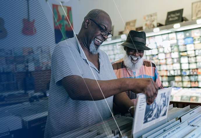 Two men shopping at a record store together